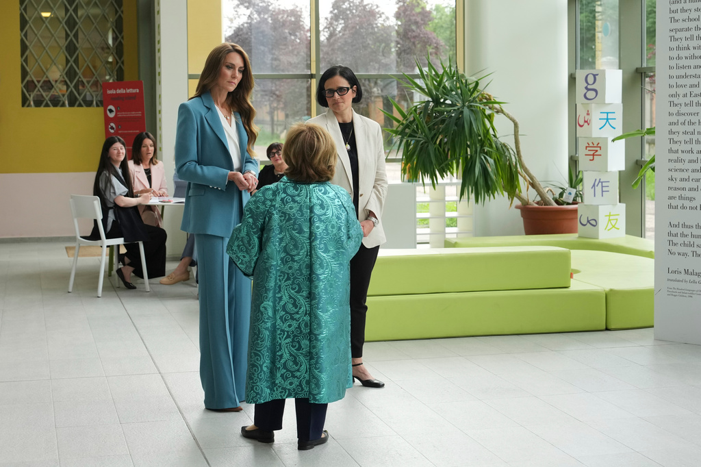 Britain's Kate, Princess of Wales, arrives at the Loris Malaguzzi International Centre and will take part in an immersive clay atelier workshop, part of a two-day trip, in Reggio Emilia, Italy, Wednesday, May 13, 2026. (AP Photo/Antonio Calanni, Pool)