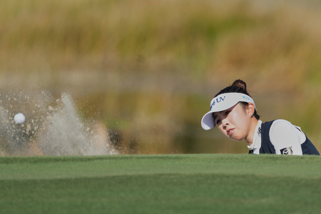 Miyu Yamashita of Japan hits from a sand trap on the ninth green during the first round of the LPGA Tour Championship golf tournament, Thursday, Nov. 20, 2025, in Naples, Fla. (AP Photo/Marta Lavandier)