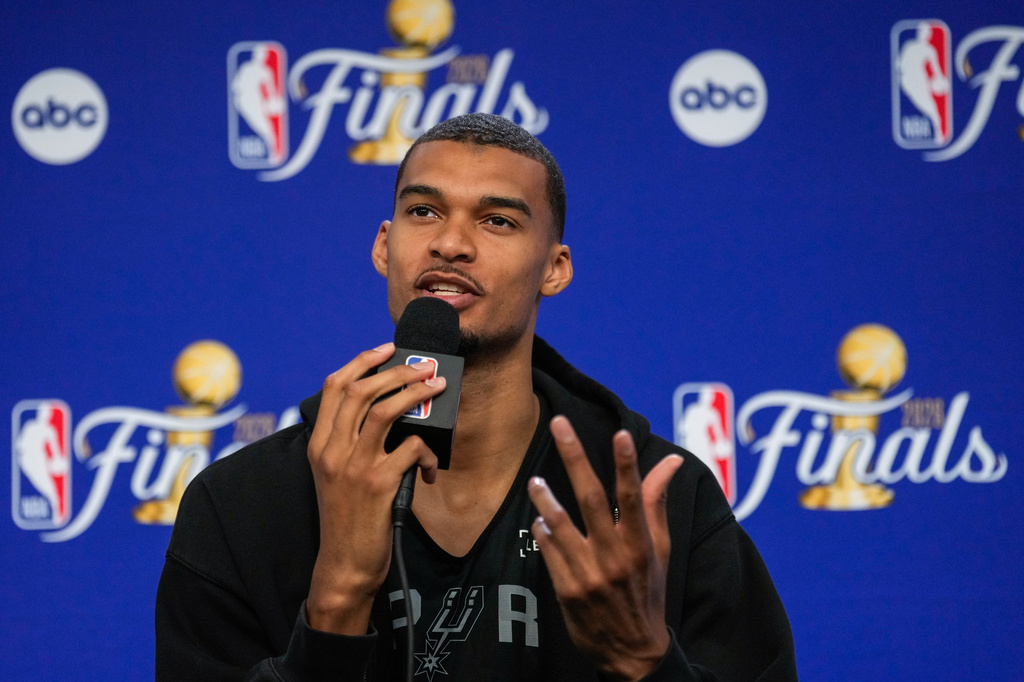 San Antonio Spurs forward Victor Wembanyama speaks prior to Game 3 of the NBA Finals basketball series against the New York Knicks, Sunday, June 7, 2026, in New York. (AP Photo/Ross D. Franklin)