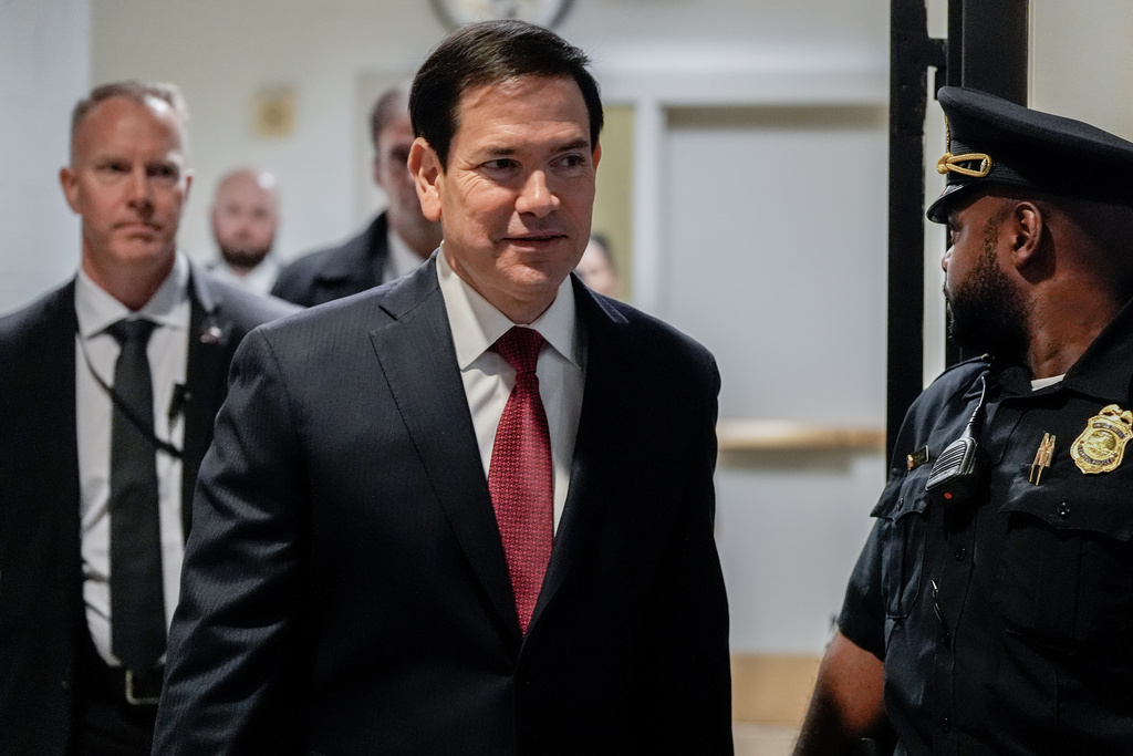 Secretary of State Marco Rubio walks to a secure room in the basement of the Capitol to brief senators on military strikes near Venezuela, Tuesday, Dec. 16, 2025, in Washington. (AP Photo/Julia Demaree Nikhinson)