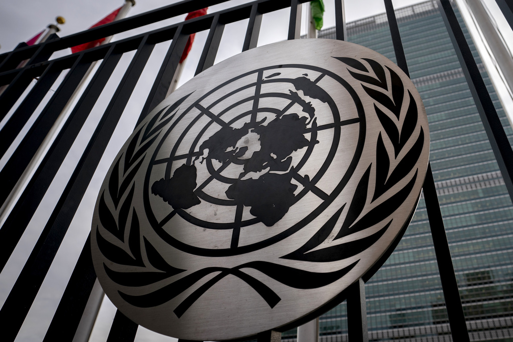 FILE - The symbol of the United Nations is displayed on the main gate outside UN headquarters, Feb. 24, 2022, in New York. (AP Photo/John Minchillo, File)