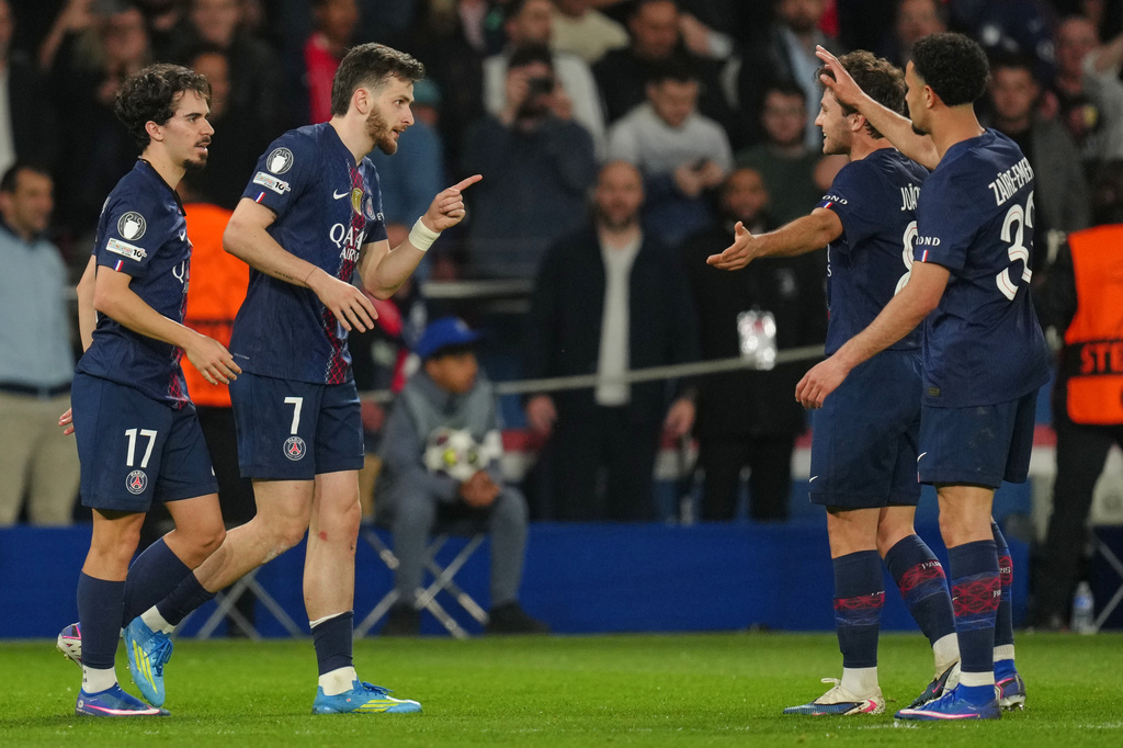 PSG's Khvicha Kvaratskhelia, second left, celebrates with teammates after scoring his side's second goal during the Champions League quarterfinal first leg soccer match between Paris Saint-Germain and Liverpool in Paris, Wednesday, April 8, 2026. (AP Photo/Aurelien Morissard)
