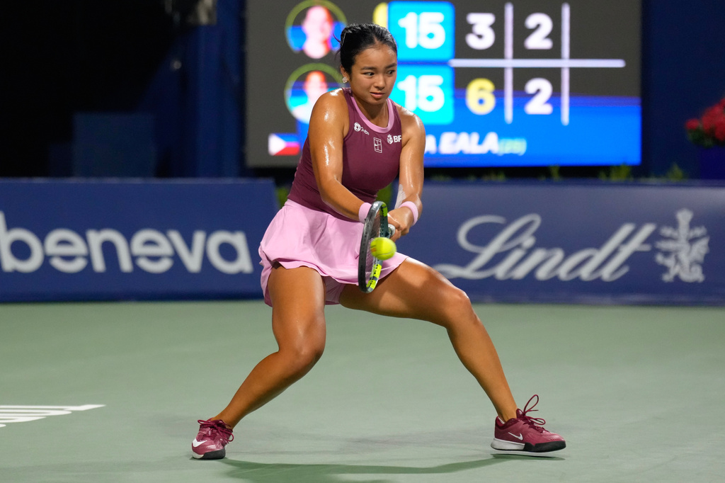 Philippines' Alexandra Eala hits a return to United States' Caty McNally during a National Bank Open tennis match in Toronto on Friday, Aug. 7, 2026. (Chris Young/The Canadian Press via AP)