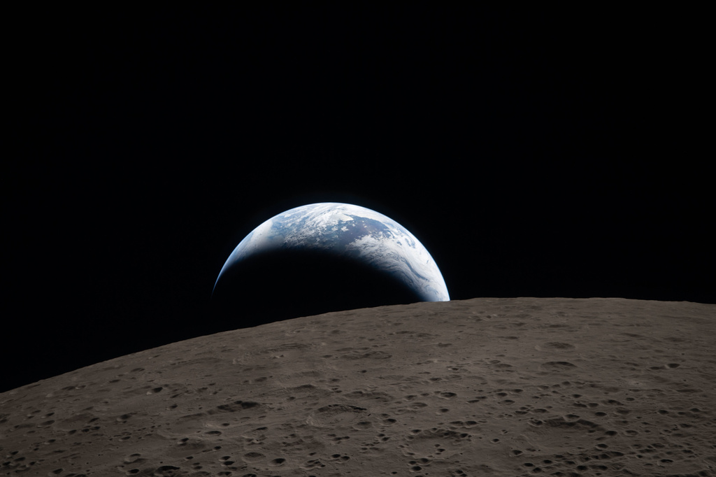 In this image provided by NASA, The Artemis II crew captured this view of an Earthset on Monday, April 6, 2026, as they flew around the Moon. (NASA via AP)