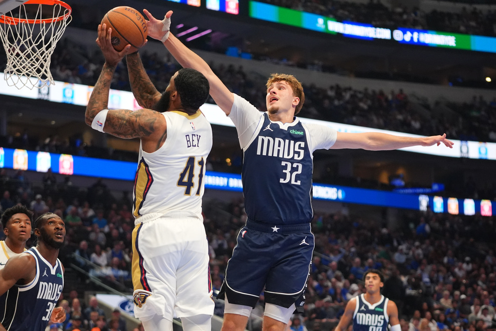 New Orleans Pelicans guard Saddiq Bey (41) shoots against Dallas Mavericks forward Cooper Flagg (32) during the first half of an NBA Cup basketball game in Dallas, Friday, Nov. 21, 2025. (AP Photo/LM Otero)