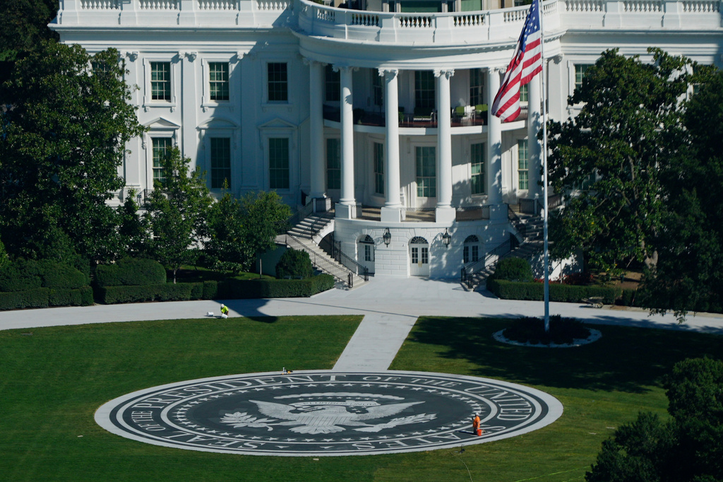 An individual is seen working on the helipad on the South Lawn of the White House, Tuesday, Sept. 15, 2026, in Washington. (AP Photo/Pablo Martinez Monsivais)