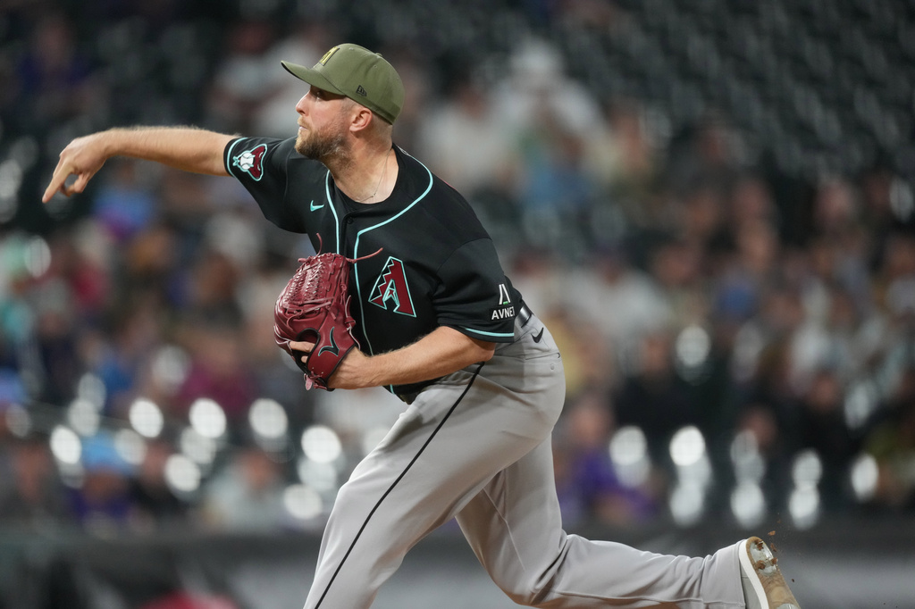 Arizona Diamondbacks starting pitcher Merrill Kelly works against the Colorado Rockies in the ninth inning of a baseball game Friday, May 15, 2026, in Denver. (AP Photo/David Zalubowski)
