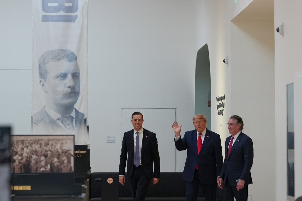 President Donald Trump tours the Theodore Roosevelt Presidential Library, Wednesday, July 1, 2026, in Medora, N.D., with Interior Secretary Doug Burgum, right, and Robbie Lauf, executive director of the Theodore Roosevelt Presidential Library. (AP Photo/Julia Demaree Nikhinson)