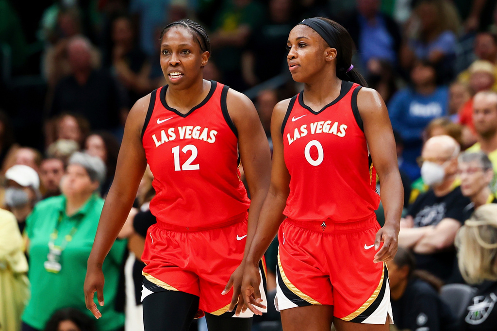 FILE - Las Vegas Aces guard Chelsea Gray (12) and guard Jackie Young (0) look on during the second half of Game 4 of a WNBA basketball playoff semifinal against the Seattle Storm, Tuesday, Sept. 6, 2022, in Seattle. (AP Photo/Lindsey Wasson, File)