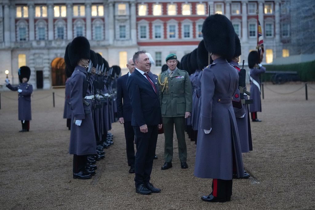 Norway's Minister of Defence Tore O. Sandvik and Britain's Secretary of State for Defence John Healey, behind, inspect a guard of honour in Horse Guards Parade in London, Thursday, Dec. 4, 2025. (AP Photo/Alastair Grant, pool)