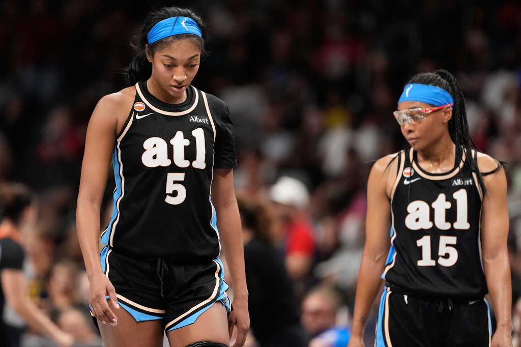 Atlanta Dream forward Angel Reese (5) and guard Allisha Gray (15) react in the second half of an WNBA basketball game Sunday, Aug. 16, 2026, in Atlanta. (AP Photo/Brynn Anderson)