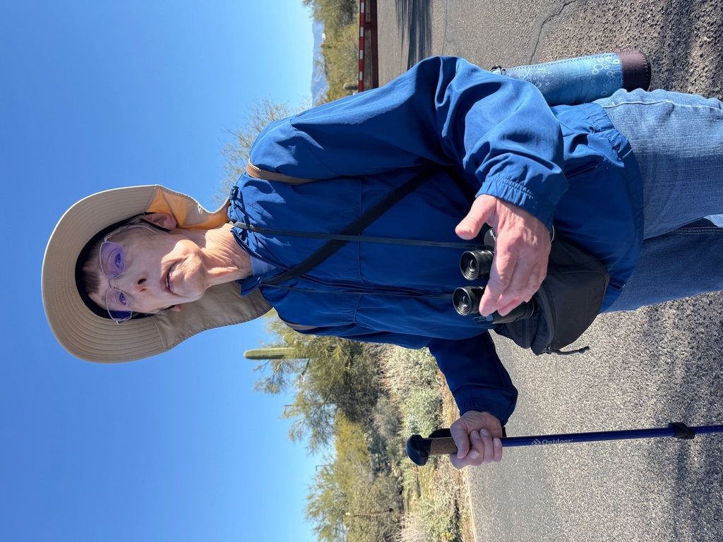 Retired Tucson area teacher Evelyn Spitzer pauses during an accessible birding walk at Feliz Paseos Park in Tucson, Ariz., on Feb. 4, 2026. (Anita Snow via AP)