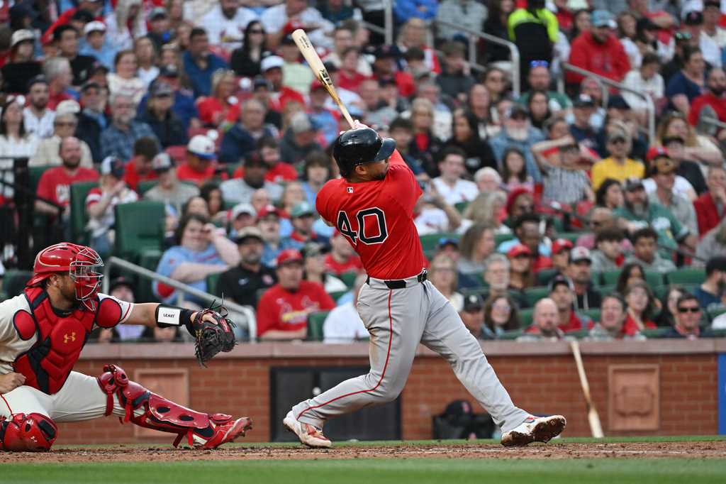 Boston Red Sox's first baseman Willson Contreras (40) hits a two run RBI double during the fourth inning of a baseball game against the St. Louis Cardinals, Saturday, April 11, 2026, in St. Louis. (AP Photo/Michael Thomas)