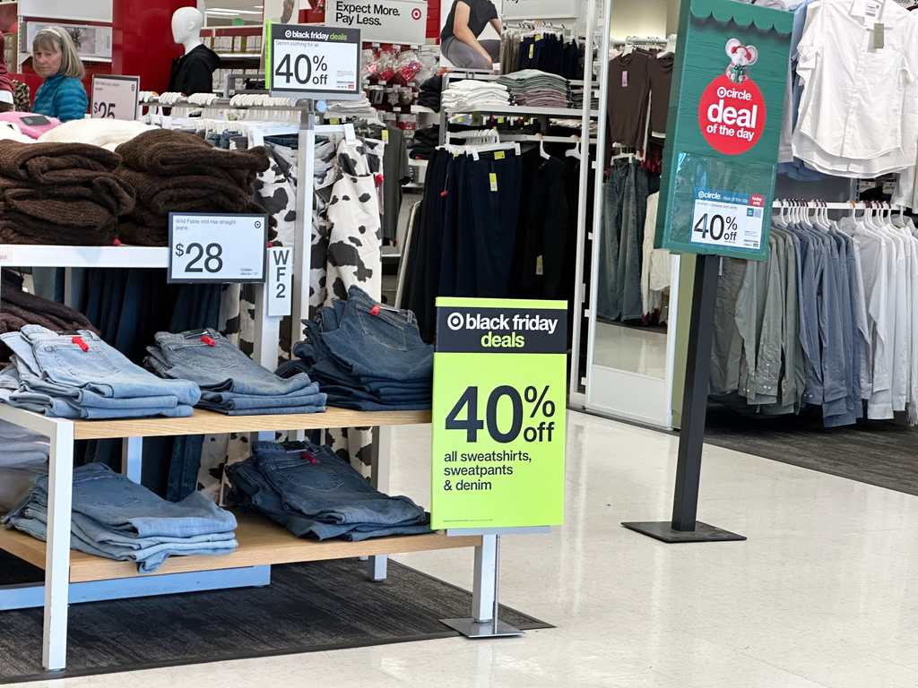 A shopper looks over items already marked down in price for Black Friday sales, Wednesday, Nov. 26, 2025, in a Target store in southeast Denver. (AP Photo/David Zalubowski)
