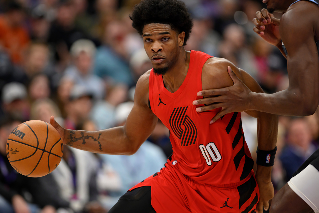 Portland Trail Blazers guard Scoot Henderson (00) drives to the basket during the first half of an NBA basketball game against the Utah Jazz, Thursday, Feb. 12, 2026, in Salt Lake City. (AP Photo/Tyler Tate)