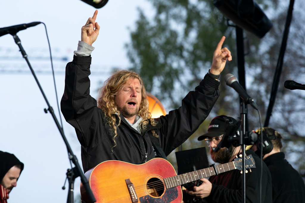FILE - Christian musician Sean Feucht of California sings to the crowd during a rally at the National Mall in Washington, Sunday, Oct. 25, 2020. (AP Photo/Jose Luis Magana, file)