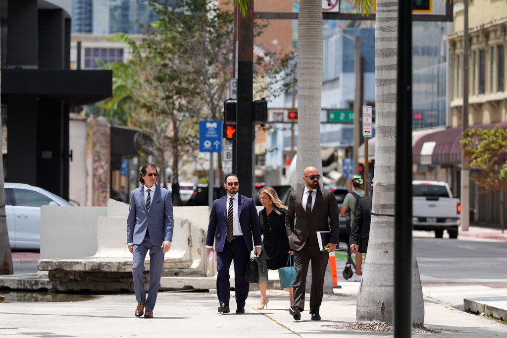 Attorney Joseph McBride, right, representing Andrew and Tristan Tate after they were arrested to face rape and sex trafficking charges against them in the United Kingdom, arrives at the C. Clyde Atkins U.S. Courthouse for a hearing, Monday, July 27, 2026, in Miami. (AP Photo/Rebecca Blackwell)
