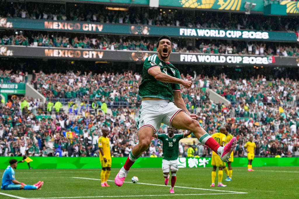 Mexico's Raul Jimenez celebrates after scoring his side's second goal during the World Cup Group A soccer match between Mexico and South Africa in Mexico City, Thursday, June 11, 2026. (AP Photo/Natacha Pisarenko)