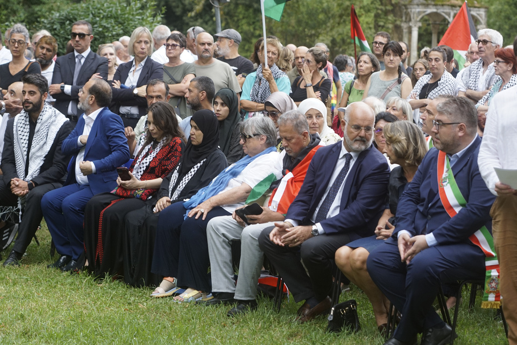 The mother, front center, of 19-year-old Palestinian woman Marah Abu Zhuri attends her funeral in Pontesserchio, near Pisa, Italy, Wednesday Aug. 20, 2025, who died there after being evacuated from Gaza. (Alessandro La Rocca/LaPresse via AP)