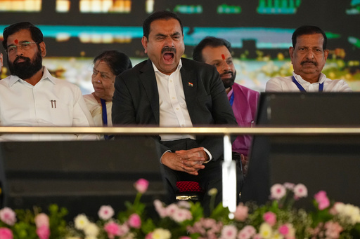 Chairman Adani Group, Gautam Adani yawns during the inauguration ceremony of the Navi Mumbai International Airport in Navi Mumbai, India, Wednesday, Oct. 8, 2025. (AP Photo/Rafiq Maqbool) Chairman Adani Group, Gautam Adani yawns during the inauguration ceremony of the Navi Mumbai International Airport in Navi Mumbai, India, Wednesday, Oct. 8, 2025. (AP Photo/Rafiq Maqbool)