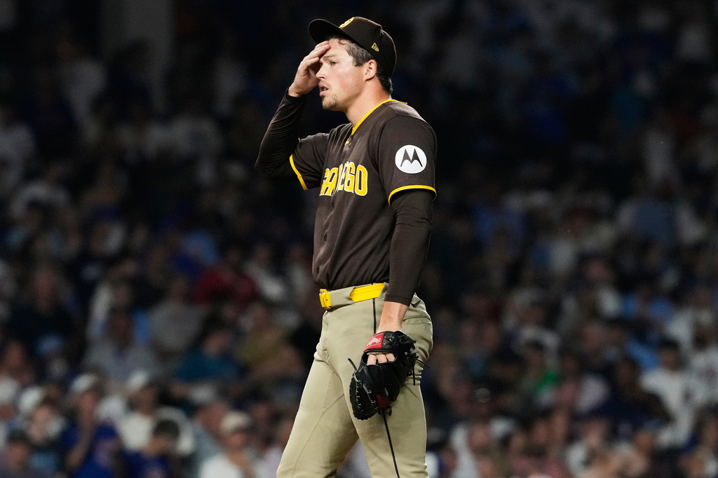 San Diego Padres relief pitcher Mason Miller wipes his face during the ninth inning of a baseball game against the Chicago Cubs in Chicago, Monday, June 29, 2026. (AP Photo/Nam Y. Huh)