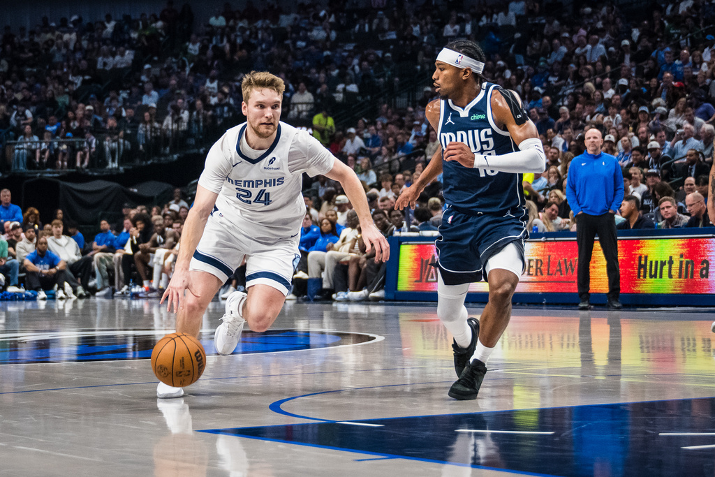 Memphis Grizzlies guard Cam Spencer (24) drives the ball during an NBA basketball game against the Dallas Mavericks, Friday, Feb. 27, 2026, in Dallas. (AP Photo/Jessica Tobias)