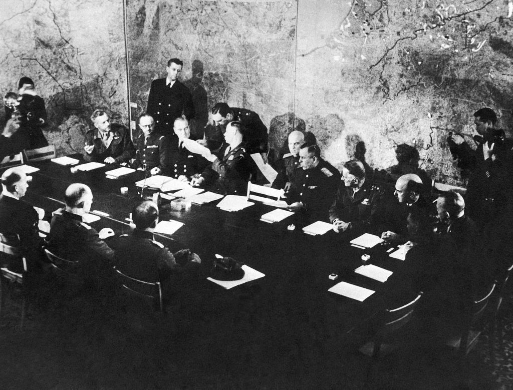 FILE - Representatives of German and Allied nations at the Supreme H. Q. War Room in Rheims, France on May 7, 1945, where the German delegates surrendered unconditionally to Britain, Russia, and the United States. (AP Photo, File)