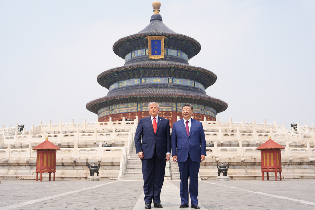 FILE - President Donald Trump, right, stands with Chinese President Xi Jinping at the Temple of Heaven on May 14, 2026, in Beijing. (AP Photo/Mark Schiefelbein, File)