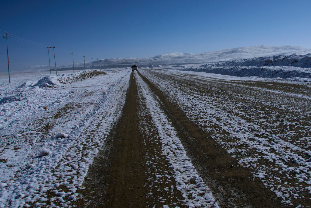 A vehicle carrying domestic tourists is seen approaching the Korola border crossing with China, in Mustang district, Nepal, April 18, 2025. (AP Photo/Niranjan Shrestha)