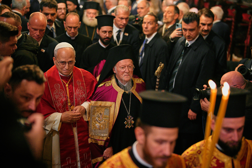 Pope Leo XIV and Ecumenical Patriarch Bartholomew I, the spiritual leader of the world's Eastern Orthodox Christians leave after attending the Doxology at the Patriarchal Church of Saint George, in Istanbul, Turkey, Saturday, Nov. 29, 2025. (AP Photo/Emrah Gurel)