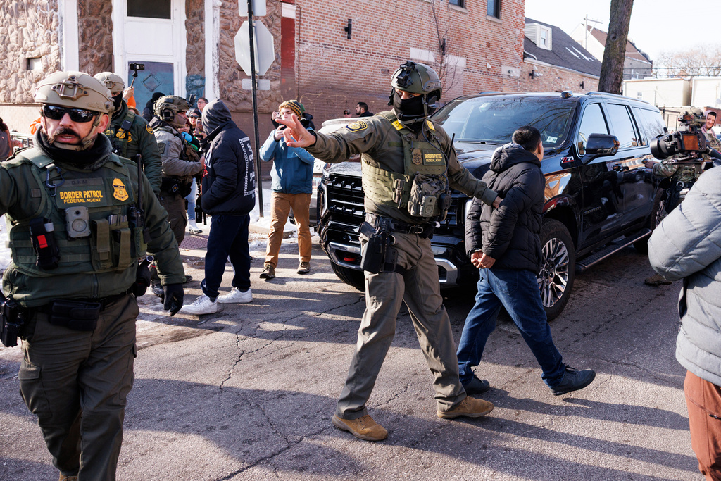 FILE - Federal immigration enforcement agents detain an individual near West 27th Street and South Ridgeway Avenue in the Little Village neighborhood of Chicago, Dec. 16, 2025. (Anthony Vazquez/Chicago Sun-Times via AP, File)