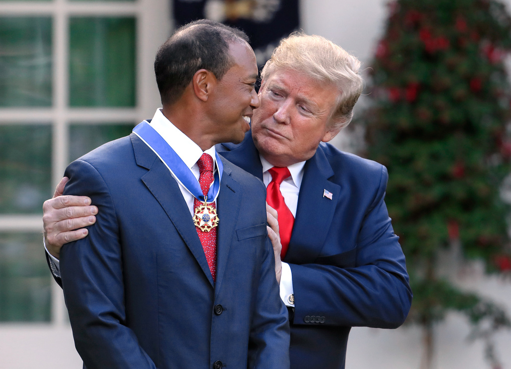 FILE - President Donald Trump, right, presents the Presidential Medal of Freedom to Tiger Woods during a ceremony in the Rose Garden of the White House in Washington, May 6, 2019. (AP Photo/Manuel Balce Ceneta, File)