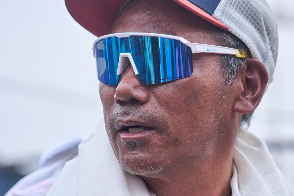 Renowned Sherpa mountain guide Kami Rita returning from Mount Everest after his record 32nd successful ascent, arrives at an airport in Kathmandu, Nepal, Friday, May 22, 2026. (AP Photo/Niranjan Shrestha)