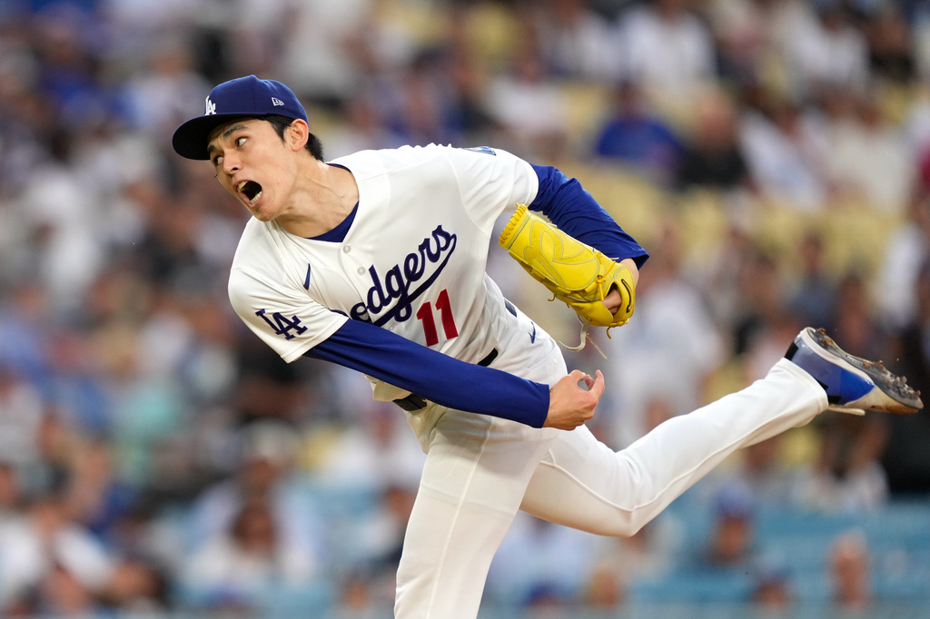 Los Angeles Dodgers starting pitcher Roki Sasaki throws to the plate during the first inning of a baseball game against the Milwaukee Brewers, Thursday, Aug. 13, 2026, in Los Angeles. (AP Photo/Mark J. Terrill)
