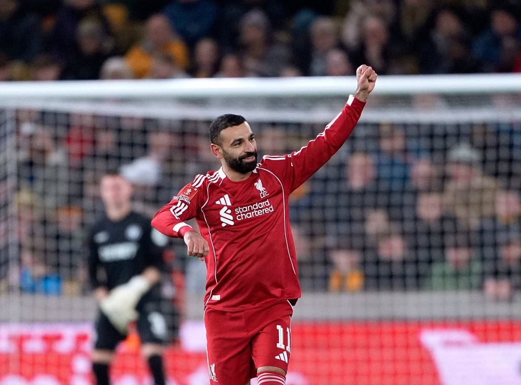 Liverpool's Mohamed Salah celebrates scoring their second goal of the game during an English FA Cup fifth round match against Wolverhampton Wanderers, Friday, March 6, 2026, in Wolverhampton, England. (Peter Byrne/PA via AP)