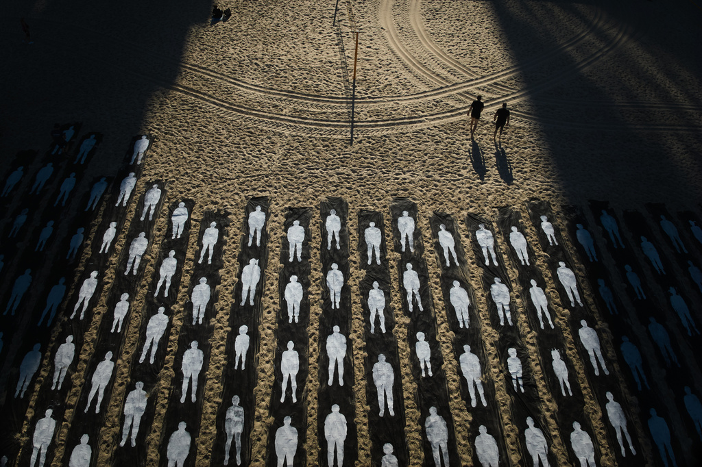People walk past an installation marking the third anniversary of the Oct. 7, 2023, Hamas-led attack on Israel, on the beachfront in Tel Aviv, Israel, Wednesday, Oct. 7, 2026. (AP Photo/Oded Balilty)