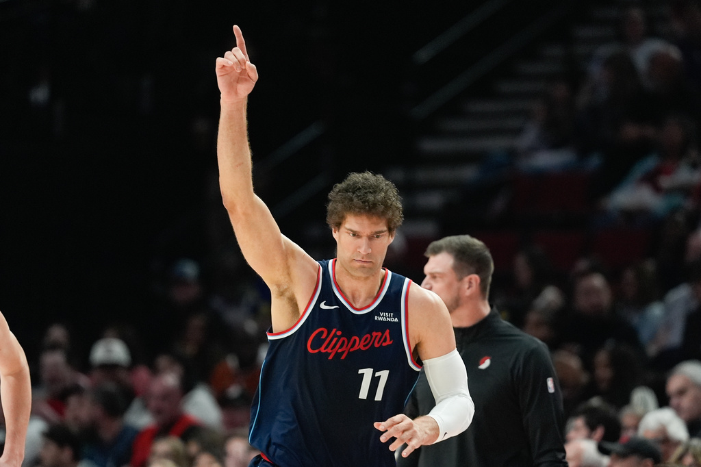Los Angeles Clippers center Brook Lopez reacts after making a shot during the first half of an NBA basketball game against the Portland Trail Blazers, Friday, April 10, 2026, in Portland, Ore. (AP Photo/Jenny Kane)