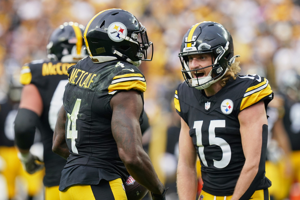 Pittsburgh Steelers wide receiver DK Metcalf (4) celebrates his touchdown with wide receiver Ben Skowronek (15) in the second half of an NFL football game against the Cleveland Browns in Pittsburgh, Sunday, Oct. 12, 2025. (AP Photo/Matt Freed)