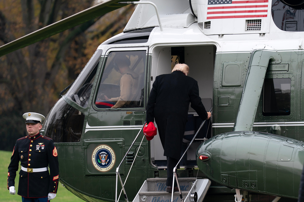 President Donald Trump boards Marine One as he departs from the South Lawn of the White House, Saturday, Nov. 22, 2025, in Washington, en route to Joint Base Andrews. (AP Photo/Jose Luis Magana)