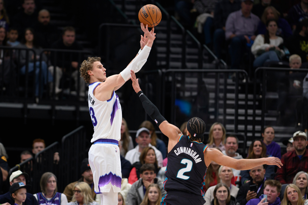 Utah Jazz forward Lauri Markkanen, left, shoots over Detroit Pistons guard Cade Cunningham (2) during the first half of an NBA basketball game, Friday, Dec. 26, 2025, in Salt Lake City. (AP Photo/Tyler Tate)