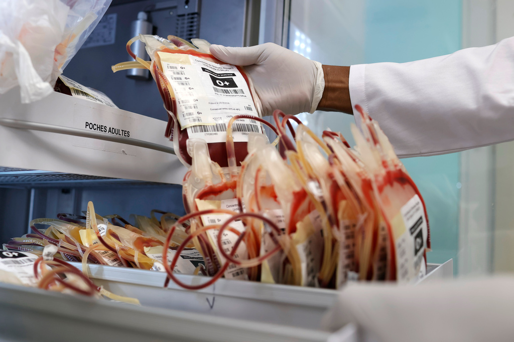 A specialist handles blood bags inside a laboratory at a hospital during a regional congress focused on strengthening laboratory capacity and preparedness following lessons from Ebola and COVID-19, in Lome, Togo, Wednesday, Sept. 16, 2026. (AP Photo/Erick Kaglan)