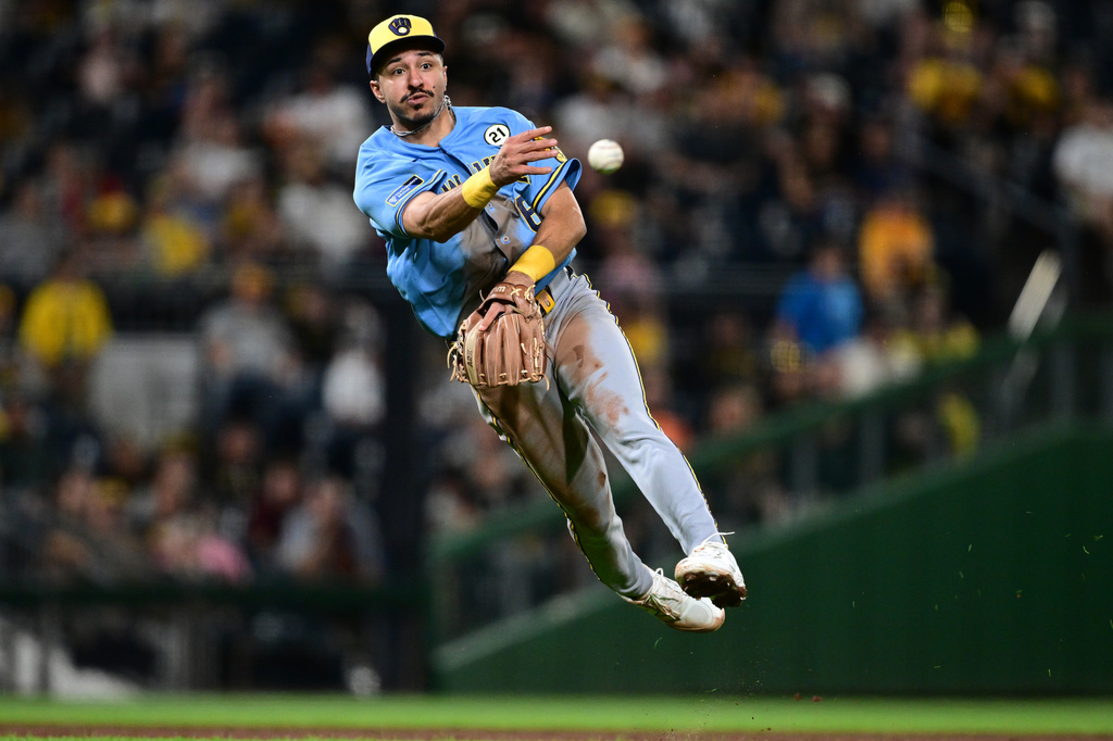 Milwaukee Brewers third baseman David Hamilton throws to first base to get out Pittsburgh Pirates' Konnor Griffin during the fifth inning of a baseball game, Tuesday, Sept. 15, 2026, in Pittsburgh. (AP Photo/David Dermer)