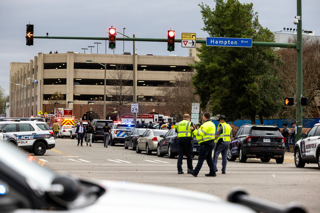 Emergency officials gather outside Old Dominion University's campus after reports of an active shooter on Thursday, March 12, 2026 in Norfolk, Va. (Kendall Warner/The Virginian-Pilot via AP)