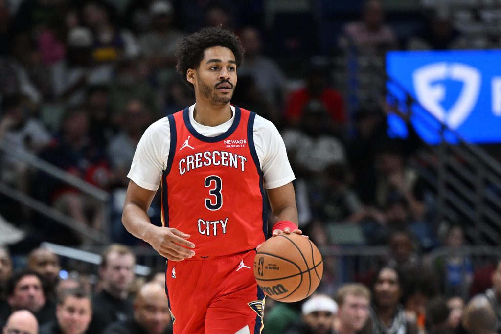 New Orleans Pelicans guard Jordan Poole looks to pass the ball in the first half of an NBA basketball game against the Milwaukee Bucks in New Orleans, Friday, Feb. 20, 2026. (AP Photo/Ella Hall)