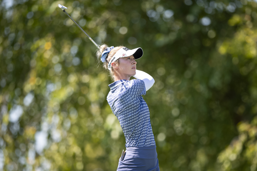 Nelly Korda tees off on the seventh hole during the first round of the Kroger Queen City Championship golf tournament, Thursday, Sept. 11, 2025, at TPC River's Bend in Cincinnati. (AP Photo/Tanner Pearson)