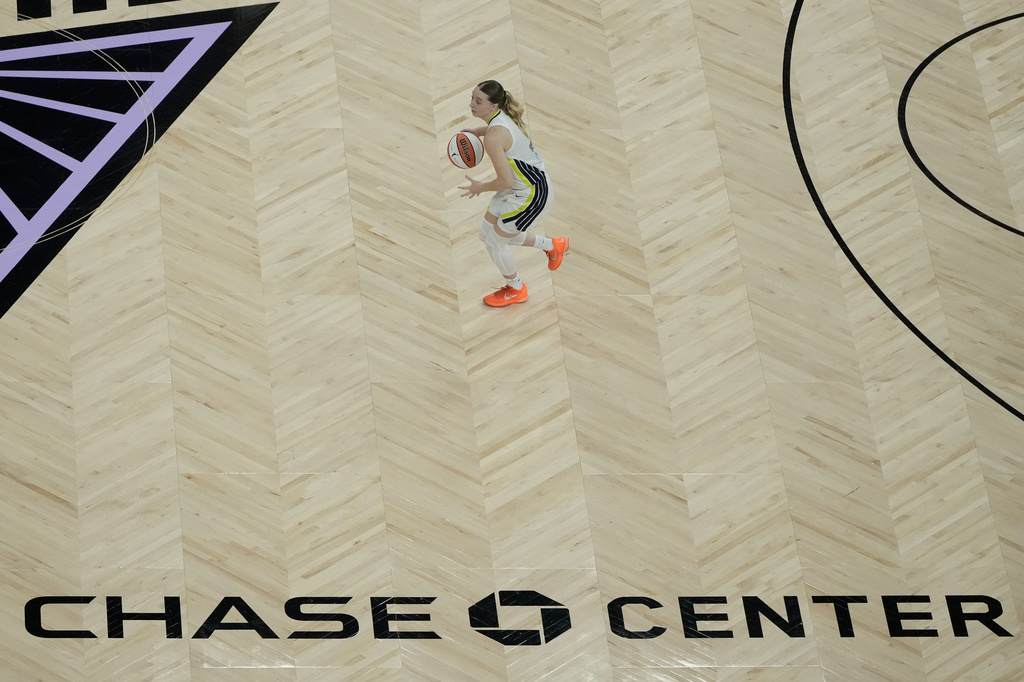 Dallas Wings guard Paige Bueckers brings the ball up the court against the Golden State Valkyries during the first half of a WNBA basketball game in San Francisco, Monday, Aug. 17, 2026. (AP Photo/Jeff Chiu)
