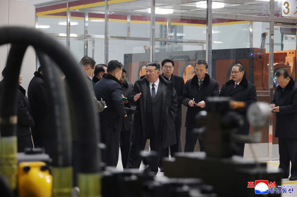 In this photo provided by the North Korean government, North Korean leader Kim Jong Un, center, visits the Ryongsong Machine Complex in North Korea Monday, Jan. 19, 2026. Independent journalists were not given access to cover the event depicted in this image distributed by the North Korean government. The content of this image is as provided and cannot be independently verified. Korean language watermark on image as provided by source reads: "KCNA" which is the abbreviation for Korean Central News Agency. (Korean Central News Agency/Korea News Service via AP)