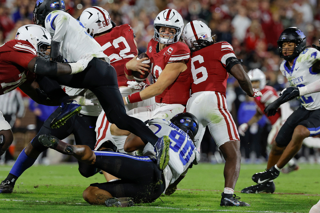 Kentucky defensive lineman Mi'quise Humphrey-Grace (90) tackles Oklahoma quarterback John Mateer (10) for a loss during the second half of an NCCA college football game, Saturday, Oct. 17, 2026, in Norman, Okla. (AP Photo/Alonzo Adams)