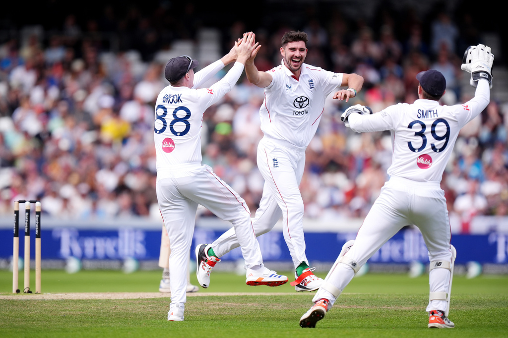 England's Josh Tongue, center, celebrates with Harry Brook and Jamie Smith, right, after bowling out Pakistan's Saud Shakeel on day three of the first Test match between England and Pakistan in Leeds, England, Friday Aug. 21, 2026. (Mike Egerton/PA via AP)