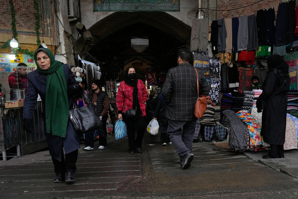People walk at Tehran's historic Grand Bazaar, Tuesday, Jan. 20, 2026, in Iran. (AP Photo/Vahid Salemi)